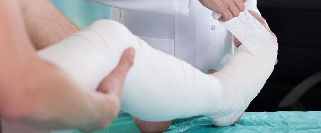 Illustration of a person holding their injured arm in a workplace setting, representing the need for legal assistance in workplace injury cases - Olympia Personal Injury Lawyers and Law Firm