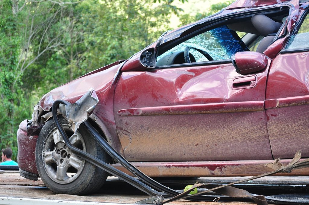 A damaged car with a broken window. - Olympia Car Accident Lawyers
