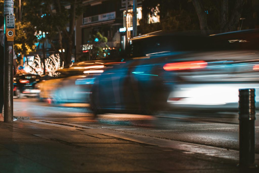 a blurry photo of a city street at night - Multi-Vehicle Collisions