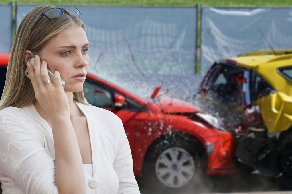 Frustrated driver on the phone after an accident with a self-driving car