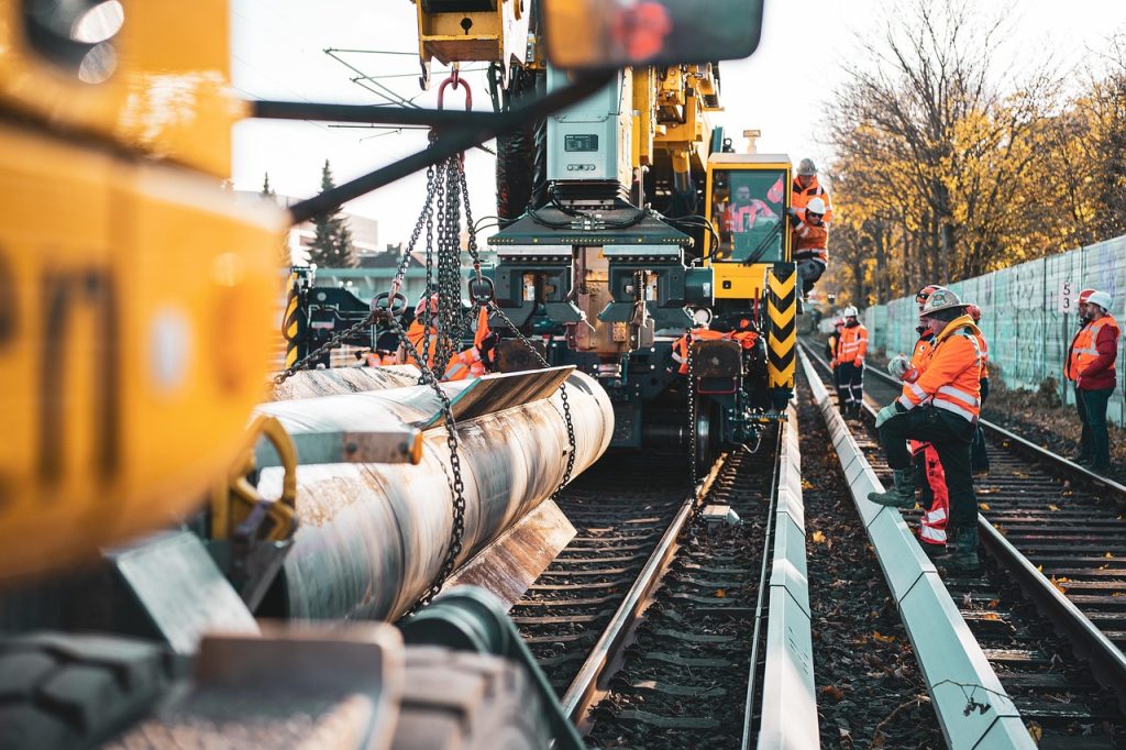 Construction crane lifting heavy materials at a building site, emphasizing the importance of safety in construction accident cases.