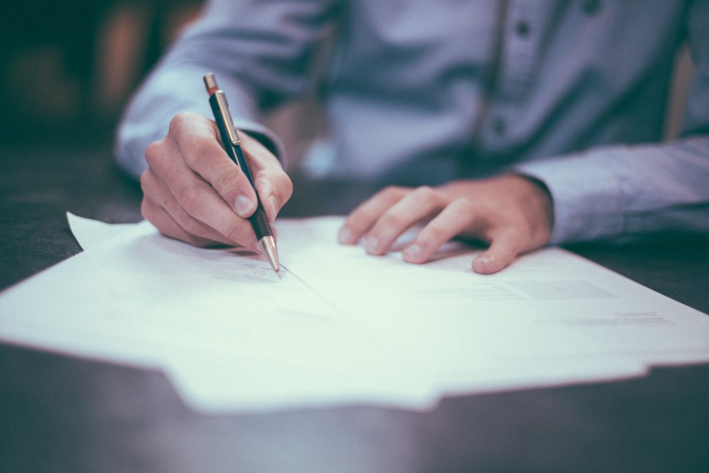 Client signing legal paperwork to renew or enforce a Washington court judgment